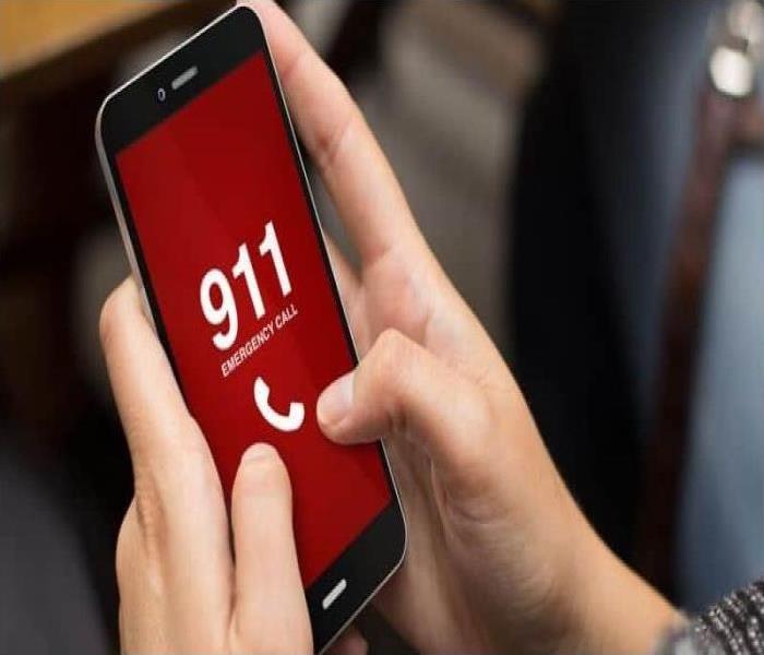 Cell phone with red screen and 911 dialed 