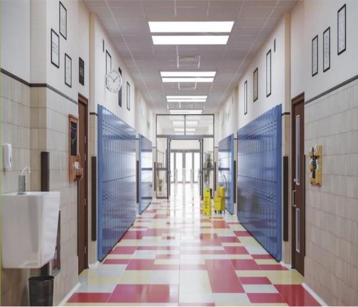 School hallway, red/white checkered tile, blue lockers, drinking fountain, hallway leads to glass doors